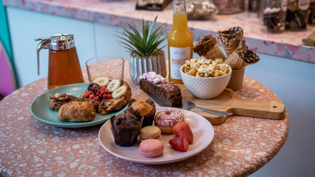 Brunch in Paris with table full of sweets pastries and juices