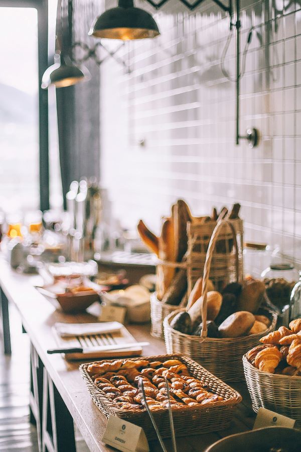 Breakfast at French bakery with bread pastries baguettes