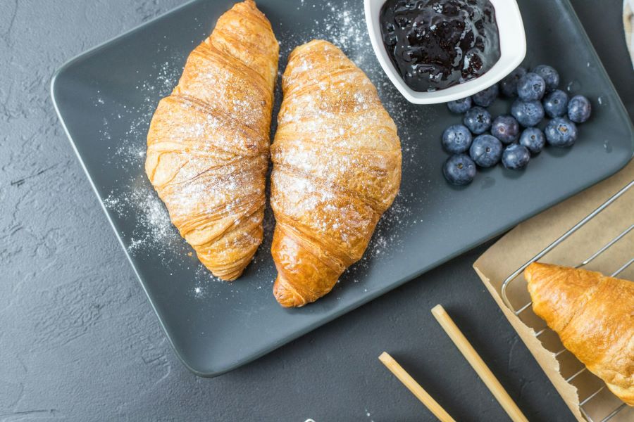 Typical french breakfast croissant blueberries