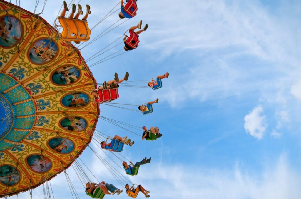 Children enjoying as carrousel ride at an amusement park