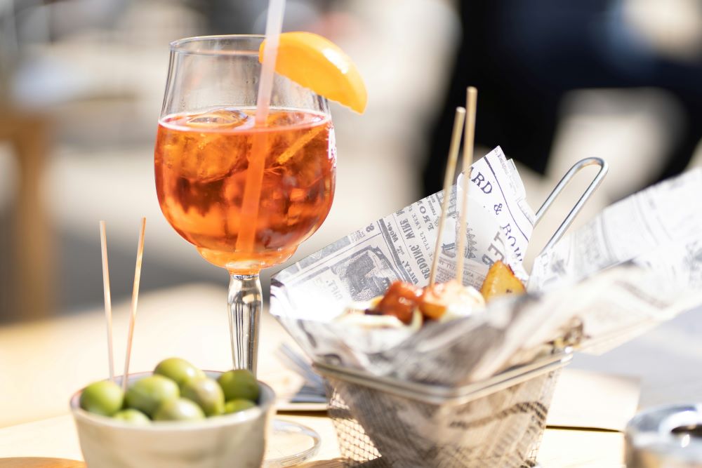 Italian aperitivo with Aperol Spritz and olives