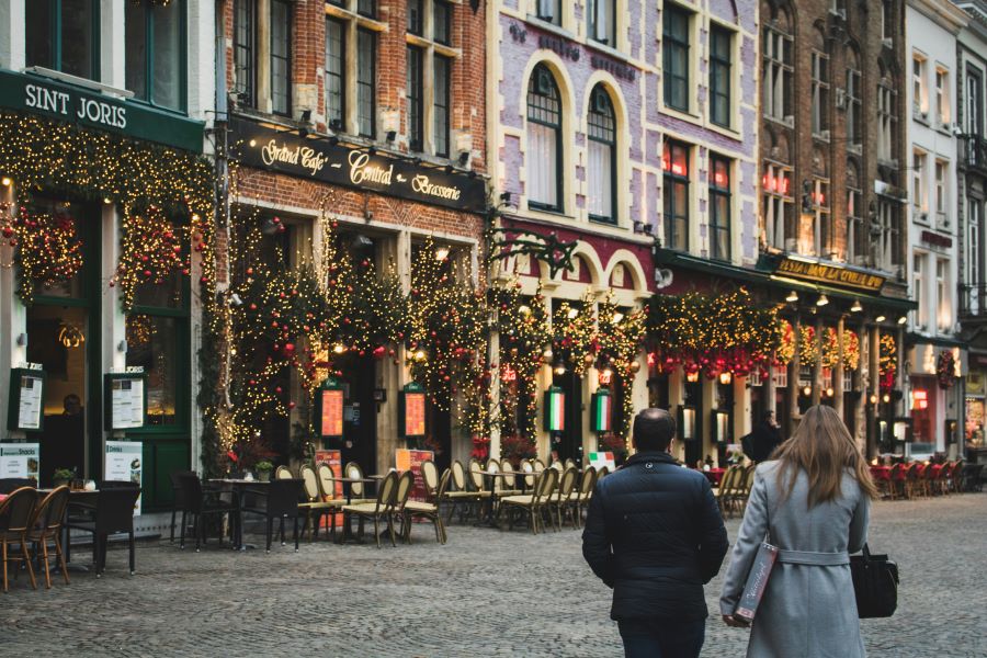 Couple enjoung Christmas decorations in Bruges Belgium