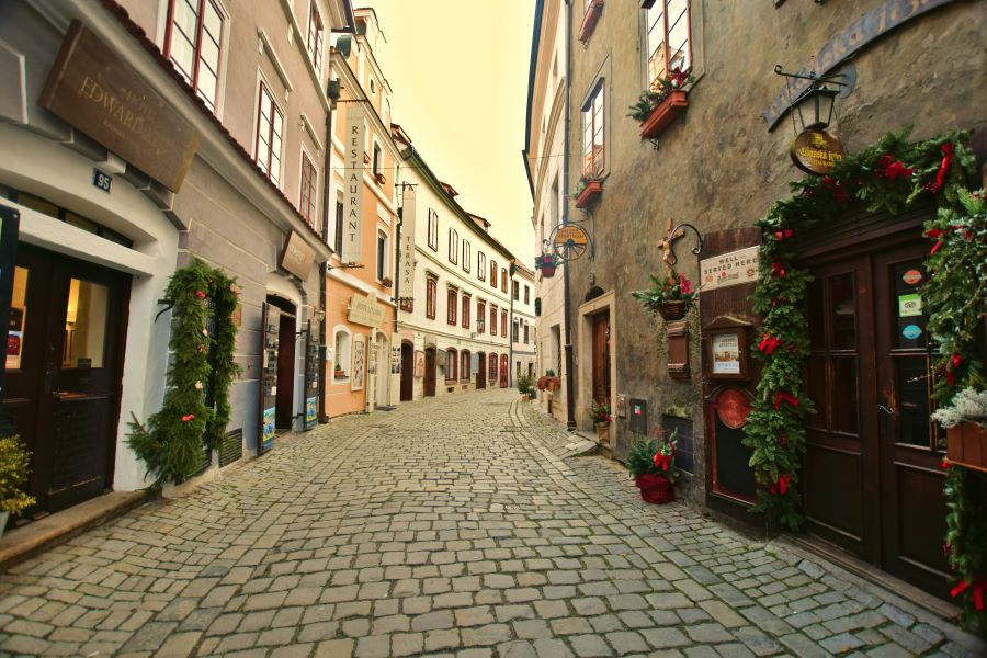 Old street with Christmas decorations in the charming town of Cesky Krumlov in Czech Republic