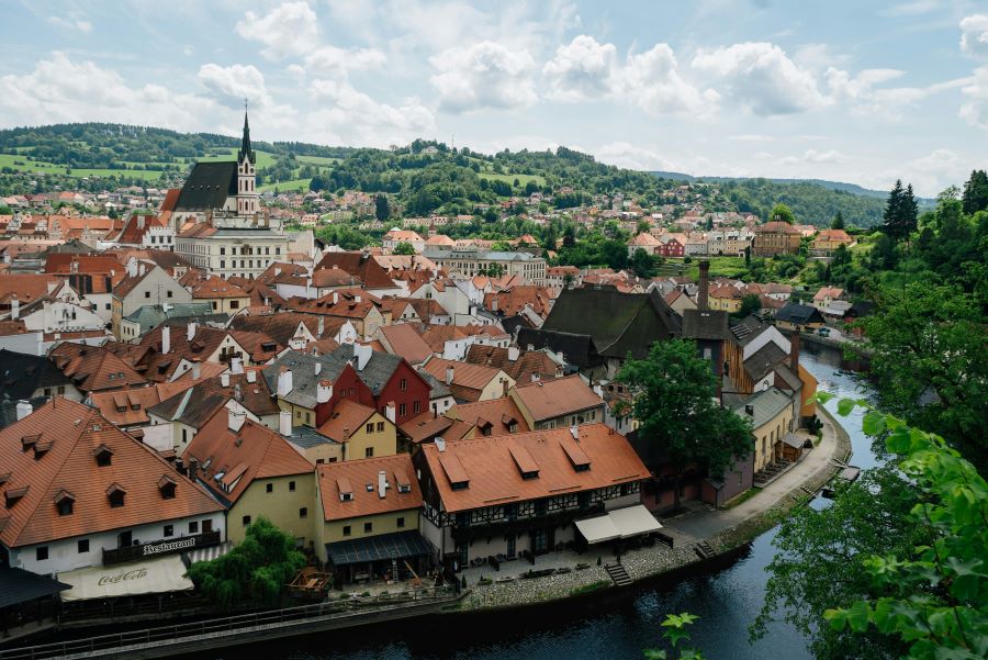 Old town with red roofs and river in Czech Republic